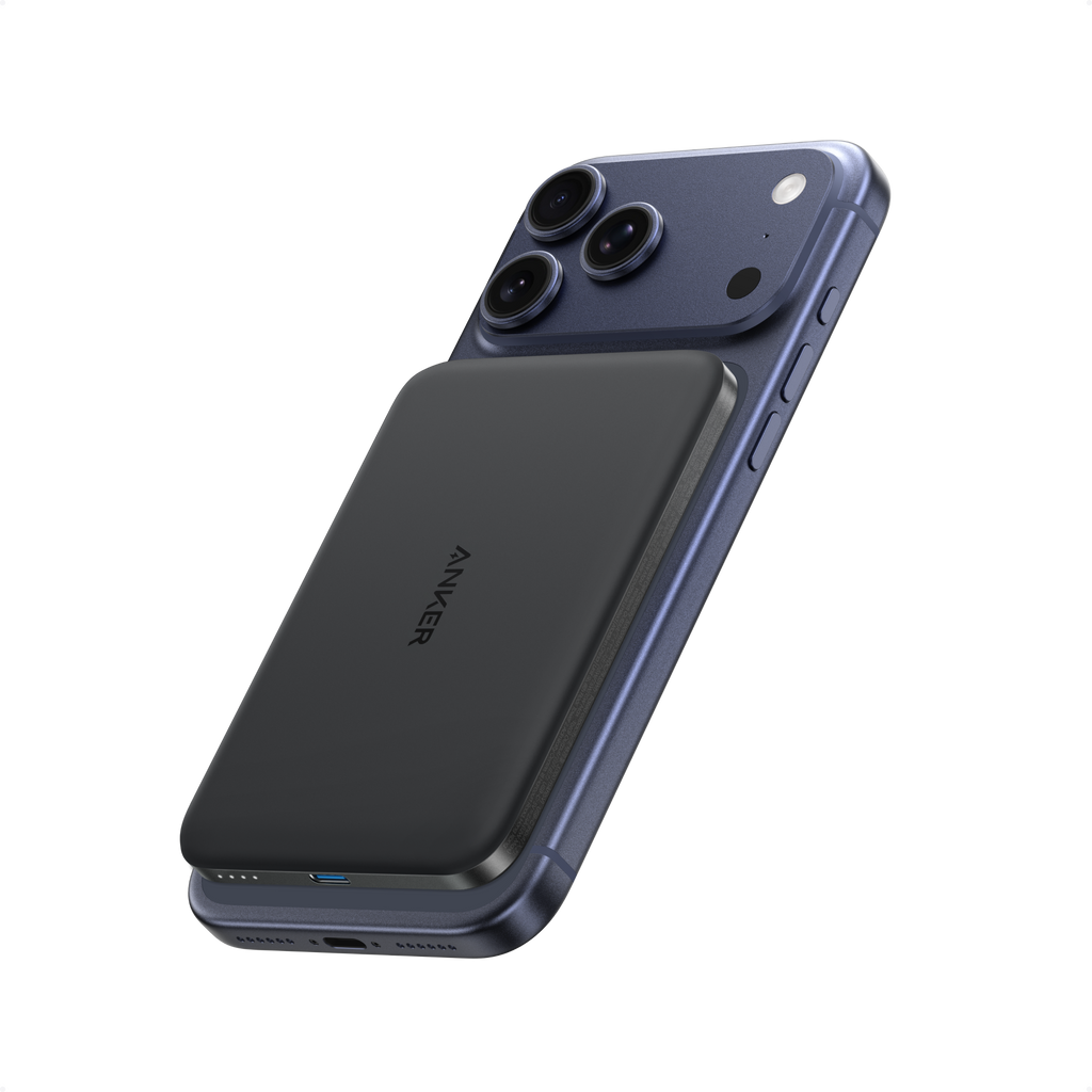 Black Anker Nano MagGo 5K power bank attached to the back of an iPhone.
