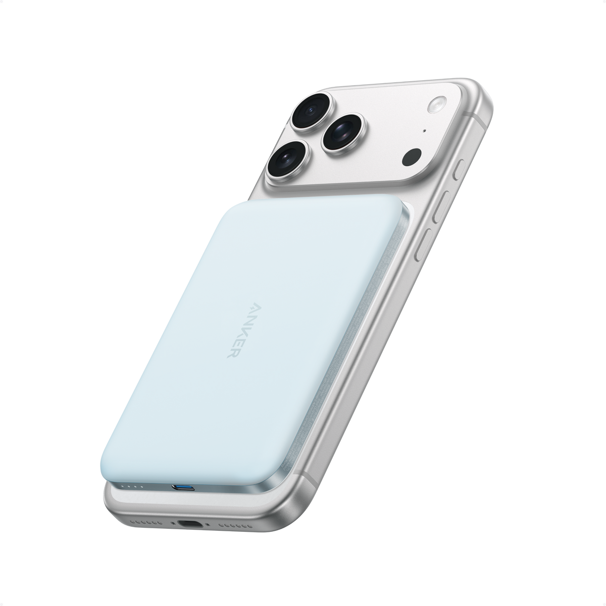Light blue Anker Nano MagGo 5K power bank attached to the back of an iPhone.