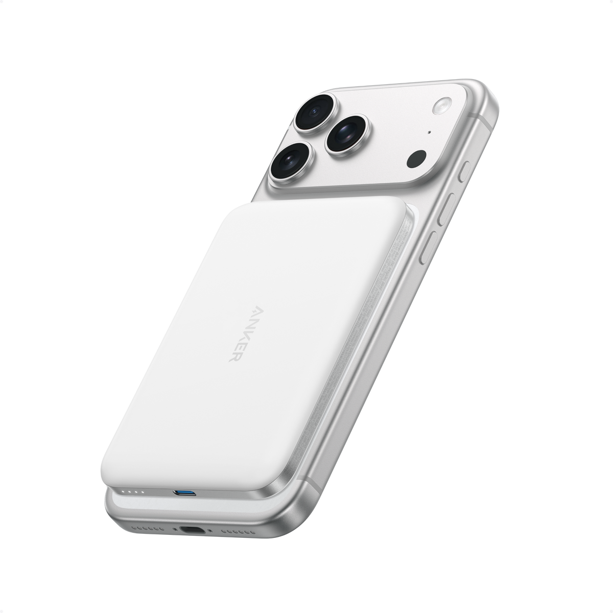 White Anker Nano MagGo 5K power bank attached to the back of an iPhone.