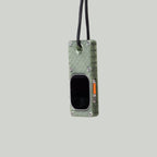 Olive green miniPhone Ultra case holding an Apple Watch Ultra, suspended from its black cord.